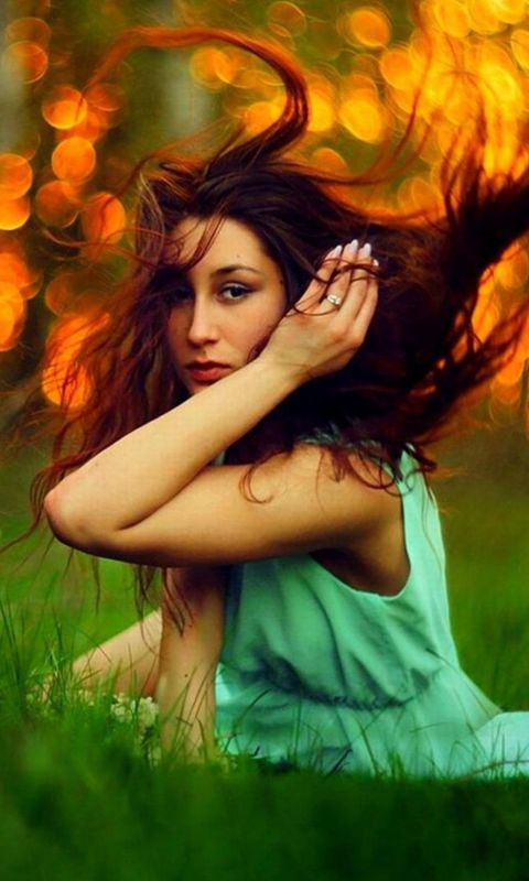Girl in green with flowing hair