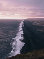 waves crashing on shore under cloudy sky during da... wallpaper