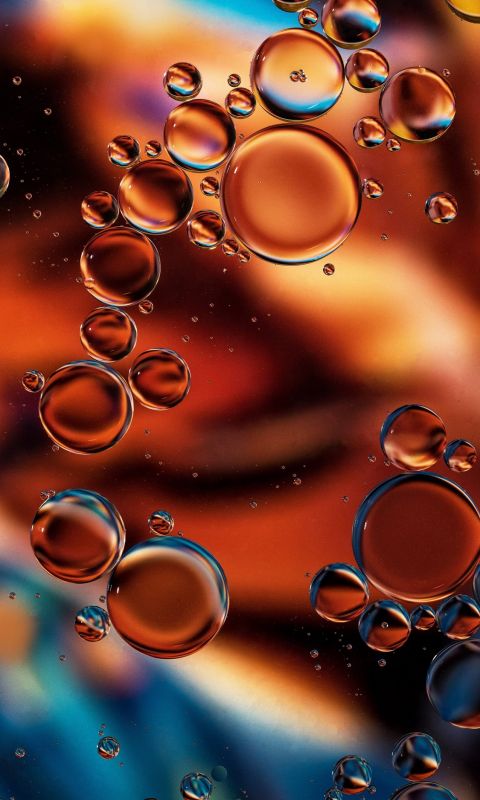 Copper Glow Oil drops on water The background is ... wallpaper