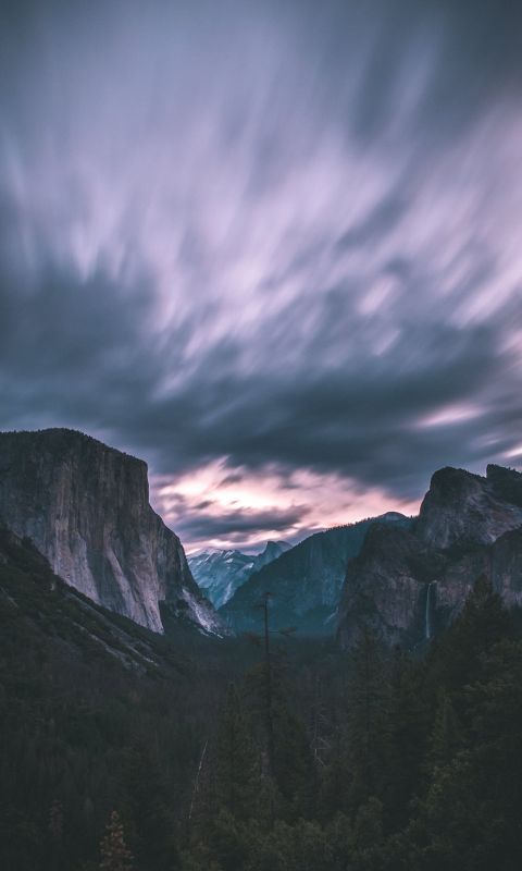 landscape photo of mountains under cloudy sky wallpaper