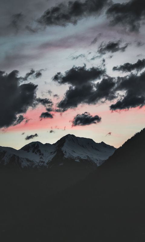 silhouette of mountain under cloudy sky wallpaper