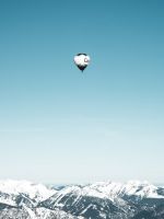 white and black hot air balloons in mid air wallpaper