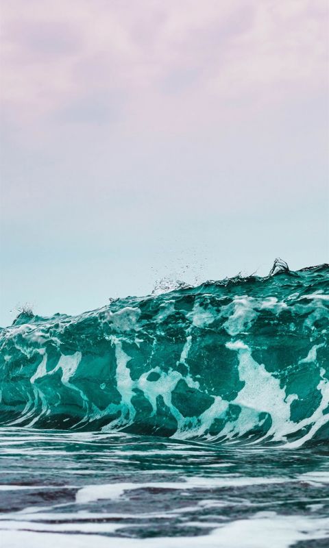 person surfing on sea waves during daytime wallpaper