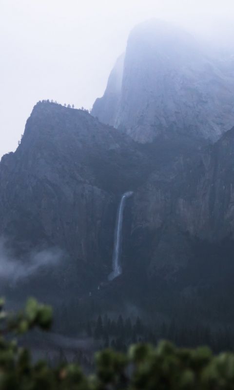 waterfall in mountain cliff wallpaper