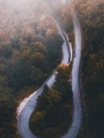 aerial photo of curved highway during daytime wallpaper