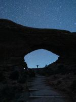 person standing near mountain during nighttime wallpaper