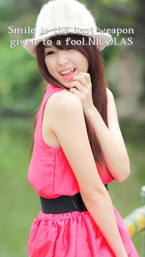 Smile is the best weapon given to a fool.NICOLAS Text Wallpaper